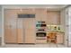 Large kitchen featuring stainless steel appliances, custom cabinetry, and workspace at 8221 Crow Valley Ln, Las Vegas, NV 89113