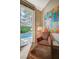 Cozy sitting area in the main bedroom with a view of the pool and backyard through sliding glass doors at 8221 Crow Valley Ln, Las Vegas, NV 89113