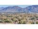 Expansive aerial view showcasing a vibrant community, lush greenery, and breathtaking mountain views in a desirable location at 8255 S Las Vegas Blvd # 1404, Las Vegas, NV 89123