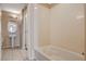 A well-lit bathroom with a sink, a shower, and tile flooring at 8255 S Las Vegas Blvd # 1404, Las Vegas, NV 89123