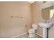 A bathroom featuring a pedestal sink, a toilet and a towel bar at 8255 S Las Vegas Blvd # 1404, Las Vegas, NV 89123