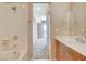 A well-lit bathroom with a sink and shower-tub combo at 8255 S Las Vegas Blvd # 1404, Las Vegas, NV 89123