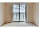 A bright room with a large sliding glass door that leads to a balcony with city views at 8255 S Las Vegas Blvd # 1404, Las Vegas, NV 89123