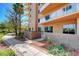 Modern condo building with balconies, landscaping, and a walkway at 8255 S Las Vegas Blvd # 1404, Las Vegas, NV 89123