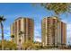 Modern high-rise condos featuring balconies, contemporary design, and beautiful palm trees enhancing the property's appeal at 8255 S Las Vegas Blvd # 1404, Las Vegas, NV 89123