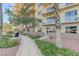Exterior view of the building, featuring a well-maintained walkway, manicured landscaping, and contemporary architectural details at 8255 S Las Vegas Blvd # 1404, Las Vegas, NV 89123