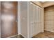 Hallway closet and entry door, featuring wood look floors and neutral walls at 8255 S Las Vegas Blvd # 1404, Las Vegas, NV 89123