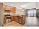 Well-equipped kitchen with stainless steel appliances, wood cabinets, and countertops at 8255 S Las Vegas Blvd # 1404, Las Vegas, NV 89123