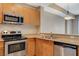 Well-equipped kitchen features stainless steel appliances, granite countertops, and wood cabinetry at 8255 S Las Vegas Blvd # 1404, Las Vegas, NV 89123