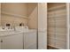 Neat laundry area has washer, dryer and ample shelving for storage at 8255 S Las Vegas Blvd # 1404, Las Vegas, NV 89123