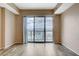Bright living room featuring wood floors and sliding glass doors leading to a city view at 8255 S Las Vegas Blvd # 1404, Las Vegas, NV 89123