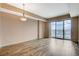 Living room featuring wood floors and sliding glass doors with city views at 8255 S Las Vegas Blvd # 1404, Las Vegas, NV 89123