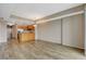 Open-concept living and dining area featuring wood-style flooring and a view into the kitchen at 8255 S Las Vegas Blvd # 1404, Las Vegas, NV 89123