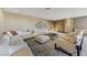 Elegant lounge featuring plush sofas, ottomans, stylish decor, and carpeted floors creating a cozy atmosphere at 8255 S Las Vegas Blvd # 1404, Las Vegas, NV 89123
