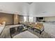 A spacious lounge features comfortable seating areas, a modern coffee table, and a TV for entertainment at 8255 S Las Vegas Blvd # 1404, Las Vegas, NV 89123