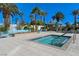 Community pool and spa area, complete with lounge chairs and fire pit seating under blue skies at 8255 S Las Vegas Blvd # 1404, Las Vegas, NV 89123