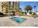 Upscale pool area featuring a spa, lounge seating and community outdoor space near high rise building at 8255 S Las Vegas Blvd # 1404, Las Vegas, NV 89123