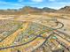 Expansive aerial view of a desert community with mountain backdrop at 828 Parker Mesa St, Las Vegas, NV 89138