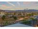 Community aerial view showcasing the neighborhood's layout, landscaping, and city skyline in the distance at 828 Parker Mesa St, Las Vegas, NV 89138