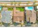 Aerial view of home with putting green in backyard between pools in community at 828 Parker Mesa St, Las Vegas, NV 89138