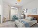 Cozy bedroom featuring stylish wallpaper, neutral carpet, comfortable bed, and light-blocking curtains at 828 Parker Mesa St, Las Vegas, NV 89138