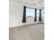 Bedroom featuring large windows with views, carpet, and ceiling fan at 828 Parker Mesa St, Las Vegas, NV 89138