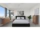 Bright bedroom with modern decor, neutral tones, and a large window at 828 Parker Mesa St, Las Vegas, NV 89138