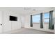 A bright bedroom with a ceiling fan and a wall-mounted TV offers modern living at 828 Parker Mesa St, Las Vegas, NV 89138