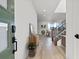 Bright entryway with wood floors, a console table, and views into the open-concept living area at 828 Parker Mesa St, Las Vegas, NV 89138