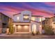 Charming two-story home featuring a modern design, a two-car garage, and desert landscaping at 828 Parker Mesa St, Las Vegas, NV 89138
