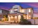Charming two-story home featuring a modern design, a two-car garage, and desert landscaping at 828 Parker Mesa St, Las Vegas, NV 89138
