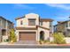 Charming two-story home with a brown garage door and well-maintained landscaping at 828 Parker Mesa St, Las Vegas, NV 89138