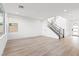 Spacious living room with light hardwood flooring and access to the front door at 828 Parker Mesa St, Las Vegas, NV 89138