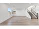 Open-concept living room with light hardwood flooring and recessed lighting at 828 Parker Mesa St, Las Vegas, NV 89138
