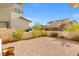 Spacious brick patio with desert landscaping, perfect for outdoor living and entertaining at 828 Parker Mesa St, Las Vegas, NV 89138