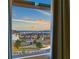 Scenic view of the city and mountains through a window with curtains at 828 Parker Mesa St, Las Vegas, NV 89138