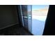 View from bedroom features sliding glass doors to backyard with pool at 83 Rock Run St, Las Vegas, NV 89148