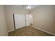 Bedroom featuring wood-look flooring, fan, and mirrored closet doors at 83 Rock Run St, Las Vegas, NV 89148