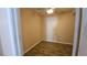 Bedroom with wood-look flooring, neutral walls, and fan at 83 Rock Run St, Las Vegas, NV 89148