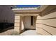 Inviting front entrance with decorative columns and a neutral-colored door, providing a welcoming first impression at 83 Rock Run St, Las Vegas, NV 89148