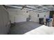 Spacious garage with storage, utility closet, and ample room for vehicles at 83 Rock Run St, Las Vegas, NV 89148