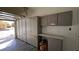 Garage featuring storage cabinets, work surface, and space for parking at 83 Rock Run St, Las Vegas, NV 89148