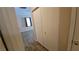 Hallway leading to a bedroom with closet and wood-look floors at 83 Rock Run St, Las Vegas, NV 89148