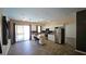 Bright kitchen with island seating, stainless steel appliances, white cabinets, and granite countertops at 83 Rock Run St, Las Vegas, NV 89148