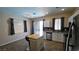 Well-lit kitchen with stainless steel appliances, modern countertops, and a movable kitchen island at 83 Rock Run St, Las Vegas, NV 89148