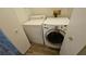 Convenient laundry closet with side-by-side washer and dryer units at 83 Rock Run St, Las Vegas, NV 89148