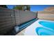 View of pool equipment and a protective brick wall enhancing the property's utility and privacy at 83 Rock Run St, Las Vegas, NV 89148