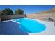 Large, inviting pool surrounded by desert landscaping, perfect for cooling off during hot summer days at 83 Rock Run St, Las Vegas, NV 89148