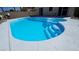 Inviting pool with steps and spa area, perfect for relaxation and entertaining in the backyard at 83 Rock Run St, Las Vegas, NV 89148