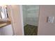 View into a walk-in closet with shelving, located next to the vanity at 83 Rock Run St, Las Vegas, NV 89148